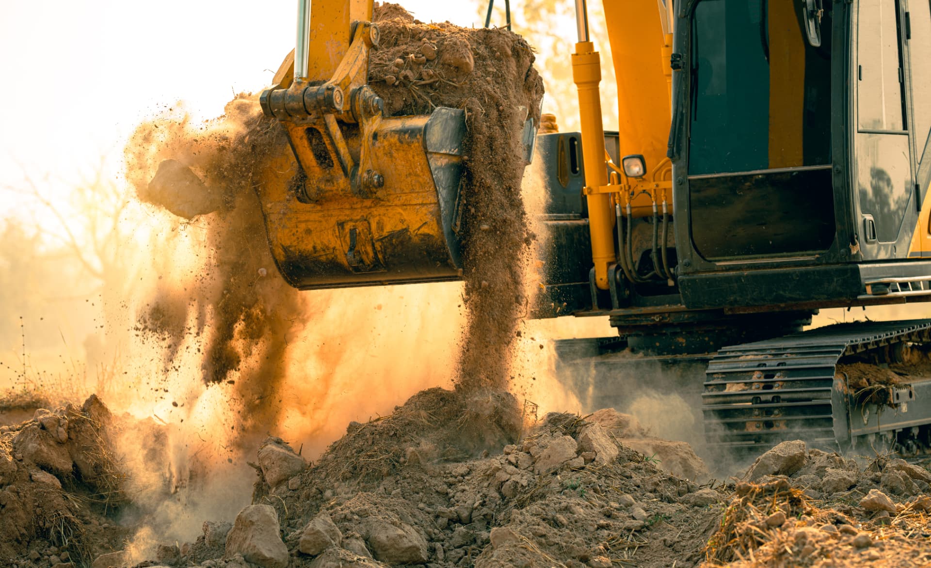 Excavator carrying out trench and earthmoving works on a civil site