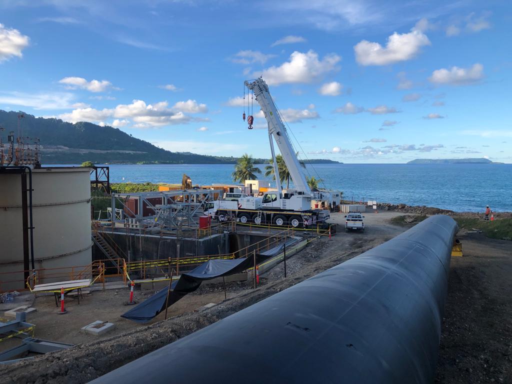 Pipeline and crane works at a coastal infrastructure site