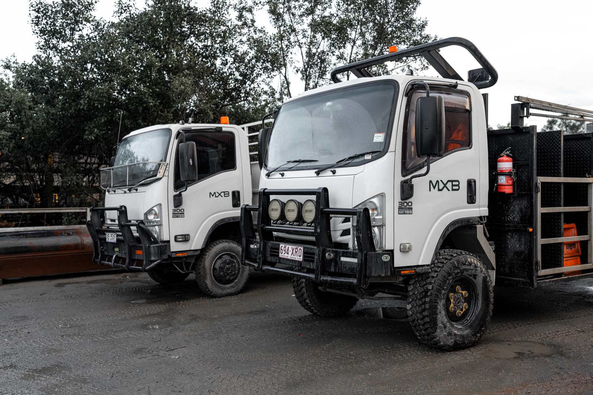 Two MXB Group service trucks